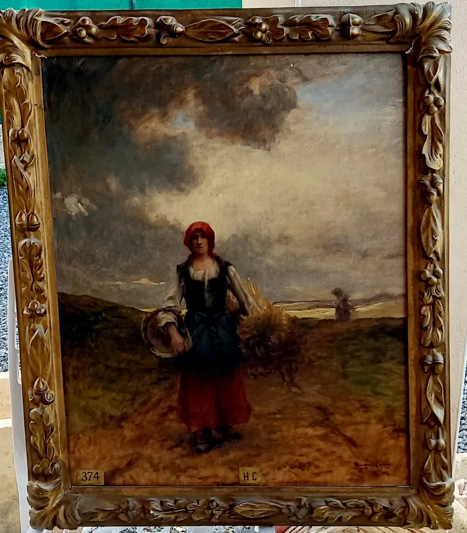Huile sur toile ancienne représentant une paysanne dans un champ, dans un cadre doré